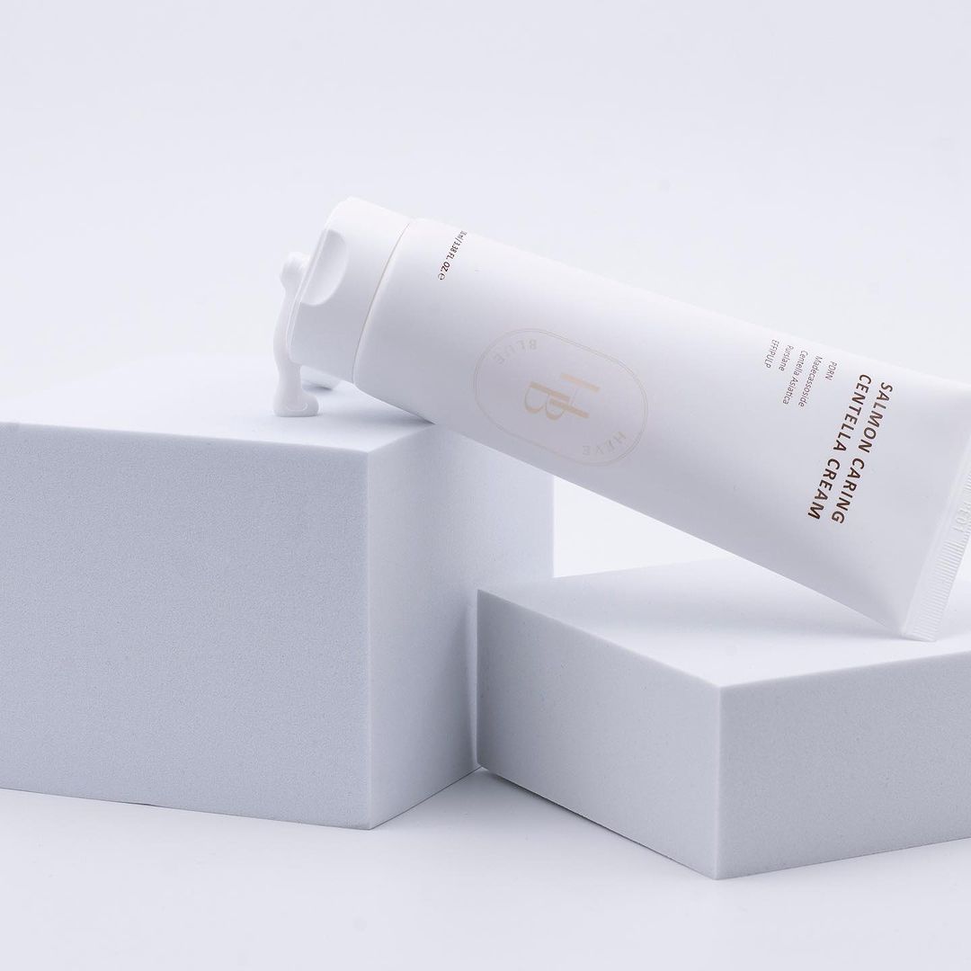 a tube of cream sitting on top of a white box