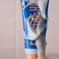 Natural exfoliating Dear Doer Body Scrub in a 100ml bottle for smooth, glowing skin.