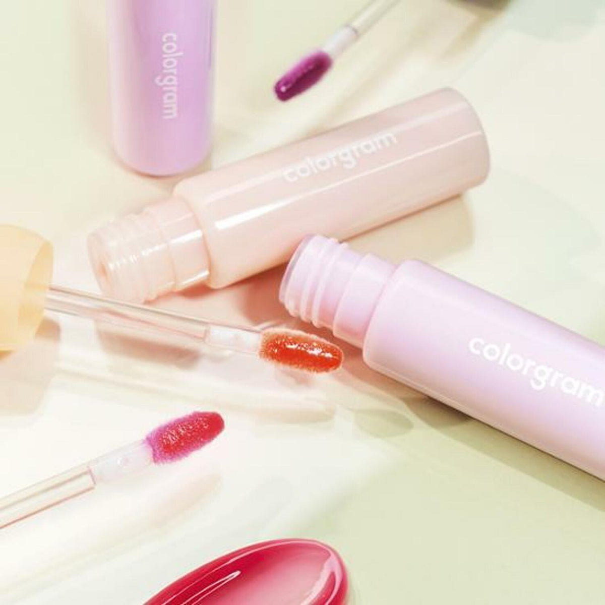 3g jar of Fruity Glass Gloss, bursting with color and shine, ideal for a playful and fruity makeup vibe.