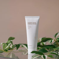 a tube of skin care sitting on top of a table