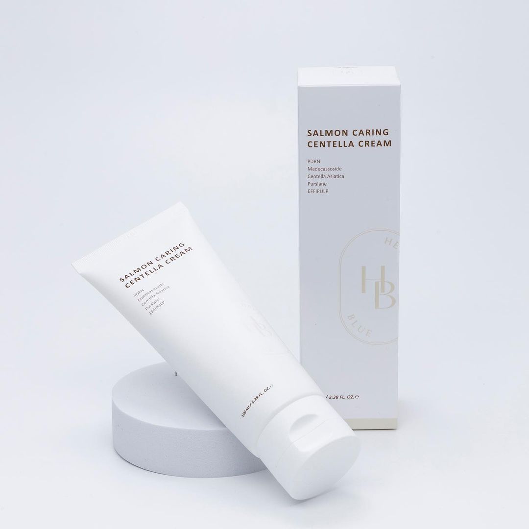 a tube of cream next to a box of cream