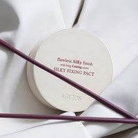 AGE20's Silky Fixing Pact SPF50+ PA++++ 14g, a lightweight powder that offers sun protection and a flawless complexion.