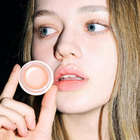 It show that she is using a Glowy Tint Balm