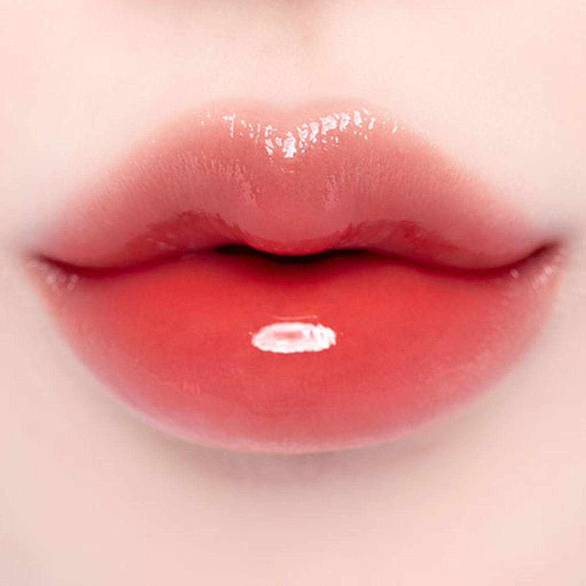 A 3.8g tube of BANILA CO Dew Glow Tint, featuring a bright, glossy formula that enhances lips with a fresh glow.