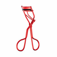 Eyelash curler with sleek design and artist-inspired look, perfect for achieving glamorous lashes.