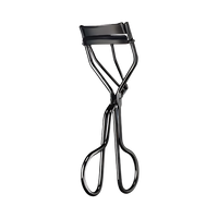 Eyelash curler with sleek design and artist-inspired look, perfect for achieving glamorous lashes.