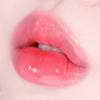 Fruity glass tint in a 2.8g package, featuring a bright and glossy color ideal for adding a pop of vibrancy to makeup.